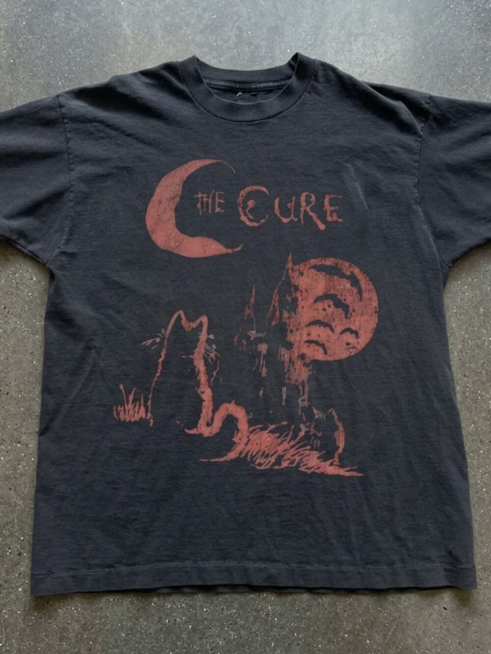 The Cure Band Tee with Red Graphic of a Crescent Moon, Castle, and Cat